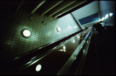 Low angle view of illuminated subway station