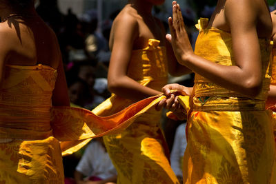 Rear view of people walking in temple