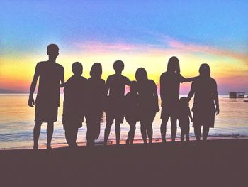 Silhouette of people at sunset