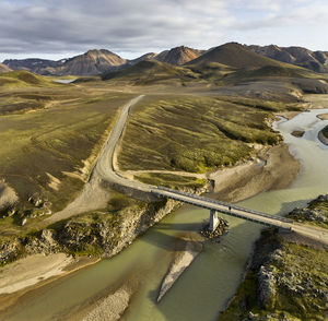 Bridge over river near hills