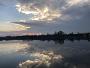 Scenic view of lake against sky during sunset