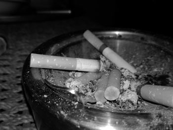 Close-up of cigarette on table