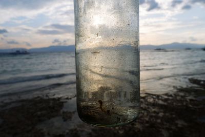 Close-up of water pipe on beach