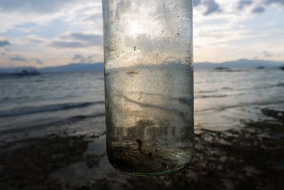 Close-up of water pipe on beach