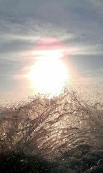 Close-up of water against sky during sunset