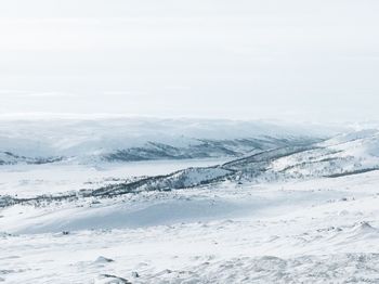 Scenic view of snow mountains against sky