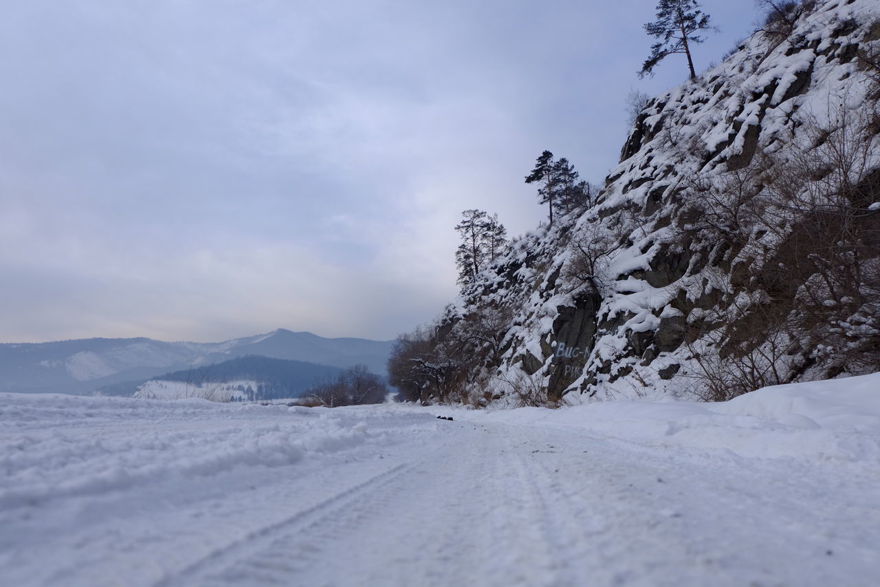 snow, winter, cold temperature, mountain, sky, tranquil scene, tranquility, scenics, season, weather, landscape, beauty in nature, nature, mountain range, cloud - sky, road, covering, tree, snowcapped mountain, the way forward
