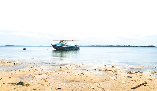 Nautical vessel on sea against sky