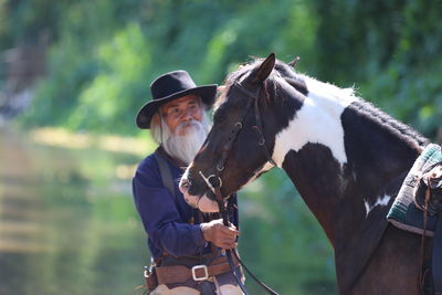 Portrait of man with horse