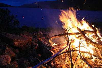 Bonfire on log at night