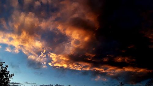 Low angle view of clouds in sky during sunset