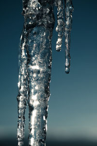 Close-up of ice against clear sky