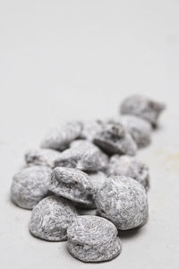 Frosted cognac truffles on white background
