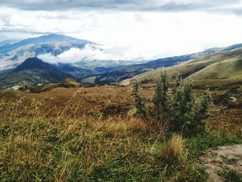 Scenic view of landscape against cloudy sky