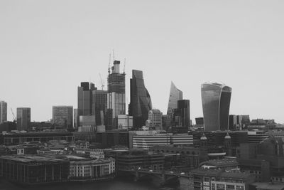 Modern buildings in city against clear sky