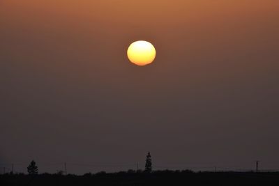 Scenic view of moon in sky during sunset