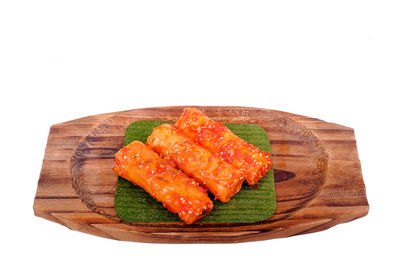 Close-up of seafood on plate against white background