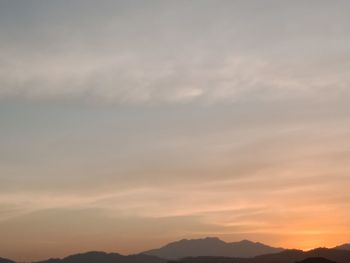 Low angle view of silhouette mountain against sky during sunset