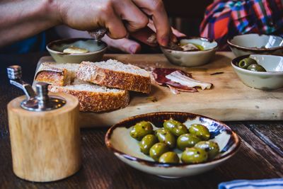 Midsection of man preparing food on table