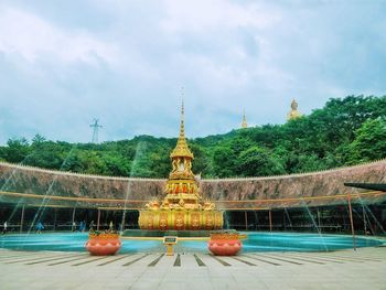 View of temple against cloudy sky