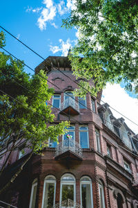 Low angle view of building against blue sky