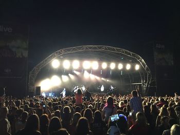 People enjoying at concert