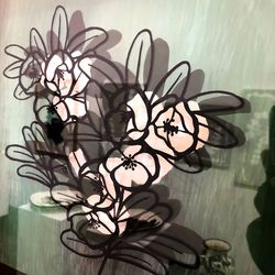 Close-up of plant on table against wall