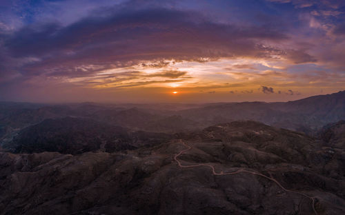 Scenic view of mountains against sky during sunset