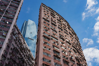 Low angle view of apartment building against sky