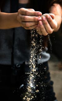 Cropped image of hand holding water