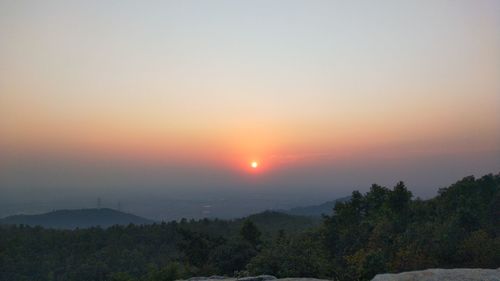 Scenic view of silhouette landscape against sky during sunset