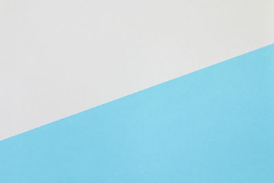 High angle view of blue paper against white background