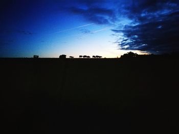 Silhouette landscape against sky