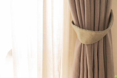 Close-up of curtain against window