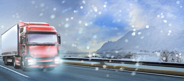 Scenic view of road against sky during winter