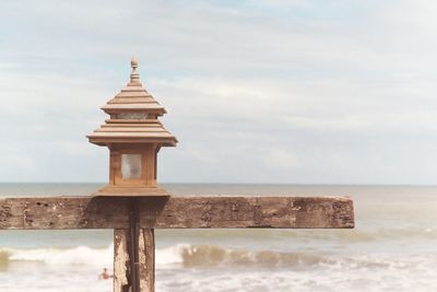 Built structure on beach against sky