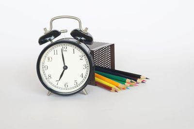 Close-up of clock on white background