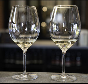 Close-up of wine glasses on table