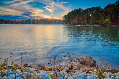 Scenic view of lake against sky during sunset