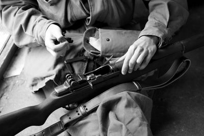 Midsection of man working at workshop