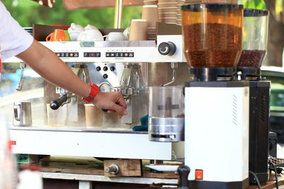 Midsection of woman working in kitchen