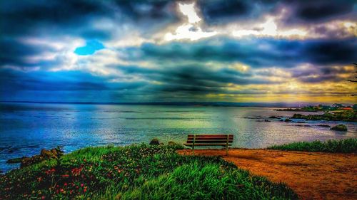 Scenic view of sea against cloudy sky