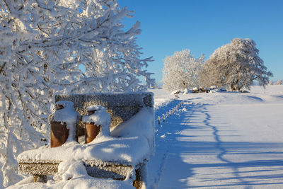 Milk churn stand in a beautiful snowy winter landscape