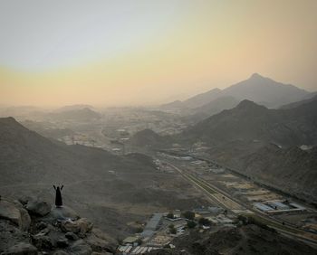 High angle view of mountains against sky during sunset