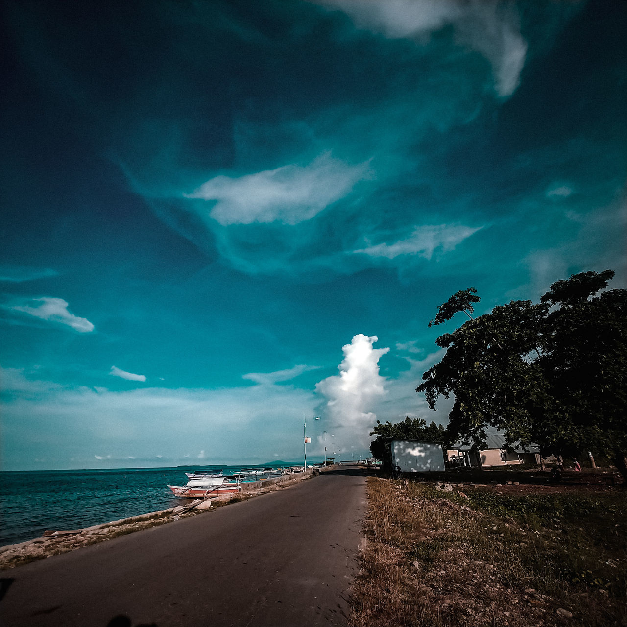 cloud - sky, sky, sea, water, land, beach, scenics - nature, beauty in nature, transportation, nature, tranquil scene, horizon, tranquility, horizon over water, no people, mode of transportation, plant, tree, outdoors