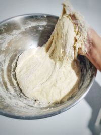 Close-up of hand holding ice cream