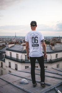 Rear view of cityscape against sky