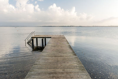 Pier over sea against sky