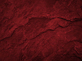 Full frame shot of rock on red wall
