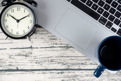 High angle view of clock on table